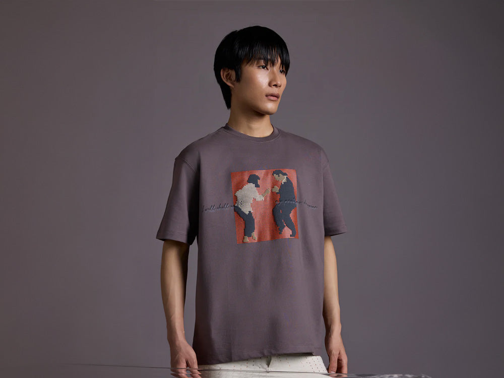 Model wearing oversized VINDOF T-shirt styled with streetwea
